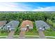 Overhead aerial of a single story home with a brown roof located on a lush lot at 15605 Derna Ter, Bradenton, FL 34211