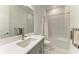 Bathroom with quartz countertop, tile floor, walk in shower and modern fixtures at 15605 Derna Ter, Bradenton, FL 34211
