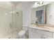 Modern bathroom featuring a glass shower, granite vanity, and neutral tile at 15605 Derna Ter, Bradenton, FL 34211