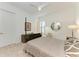 Bright bedroom with neutral tones, a four-poster bed, and soft carpet at 15605 Derna Ter, Bradenton, FL 34211