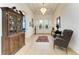 Welcoming foyer with decorative furniture, a hardwood floor, and a statement chandelier at 15605 Derna Ter, Bradenton, FL 34211