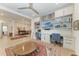 Spacious home office with built-in bookshelves, desk space, and a view to the dining area at 15605 Derna Ter, Bradenton, FL 34211