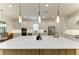 Bright open concept kitchen featuring a large kitchen island with seating at 15605 Derna Ter, Bradenton, FL 34211