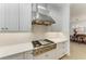 Bright kitchen featuring white cabinets, stainless steel appliances and light countertops at 15605 Derna Ter, Bradenton, FL 34211