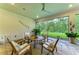 Covered patio featuring an outdoor dining area with beautiful views of nature at 15605 Derna Ter, Bradenton, FL 34211