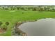 Scenic view of the pond on the golf course at 15605 Derna Ter, Bradenton, FL 34211
