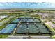 Aerial view of the tennis courts, a beautiful amenity for the community at 15605 Derna Ter, Bradenton, FL 34211