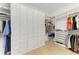Spacious walk-in closet with custom shelves and ample storage at 15605 Derna Ter, Bradenton, FL 34211
