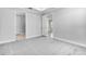 Spacious bedroom with soft carpeting and doorways to other rooms at 16234 Isola Pl, Bradenton, FL 34211