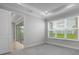 Cozy bedroom with plush carpeting, large windows, and neutral color scheme, creating a relaxing atmosphere at 16234 Isola Pl, Bradenton, FL 34211