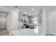 Bright kitchen featuring gray cabinets, stainless appliances, and a quartz countertop island at 16234 Isola Pl, Bradenton, FL 34211