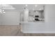 Bright kitchen with gray cabinetry, stainless appliances, and a large center island at 16234 Isola Pl, Bradenton, FL 34211