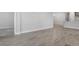 Bright living room featuring wood-style tile flooring and neutral paint at 16234 Isola Pl, Bradenton, FL 34211