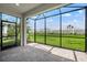 Covered patio overlooking a lush green lawn and fenced yard at 16234 Isola Pl, Bradenton, FL 34211