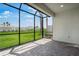 Screened lanai with brick floor overlooks backyard at 16234 Isola Pl, Bradenton, FL 34211