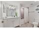 Well-lit bathroom featuring a bathtub, shower, and vanity with neutral wall color and tiling at 18113 Gawthrop Drive # 101, Lakewood Ranch, FL 34211