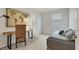 Bedroom featuring neutral walls, a work desk, and a decorative map at 18113 Gawthrop Drive # 101, Lakewood Ranch, FL 34211