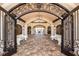 Grand entrance with wrought iron details leading to a beautifully designed interior space at 18113 Gawthrop Drive # 101, Lakewood Ranch, FL 34211