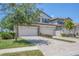 Charming home featuring a brick driveway, two-car garage, and manicured landscaping at 18113 Gawthrop Drive # 101, Lakewood Ranch, FL 34211