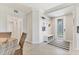 Inviting foyer with stylish decor, tile flooring, and a decorative front door at 18113 Gawthrop Drive # 101, Lakewood Ranch, FL 34211
