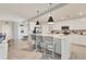 Well-lit kitchen with a large island, stainless steel appliances, and white cabinetry at 18113 Gawthrop Drive # 101, Lakewood Ranch, FL 34211