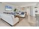 Bright and airy living room featuring neutral decor and tile floors at 18113 Gawthrop Drive # 101, Lakewood Ranch, FL 34211