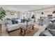 Comfortable living room featuring stylish furniture, modern lighting, and an open layout at 18113 Gawthrop Drive # 101, Lakewood Ranch, FL 34211