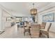 Open living space featuring a dining area and a living area at 18113 Gawthrop Drive # 101, Lakewood Ranch, FL 34211