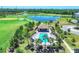Inviting community pool surrounded by comfortable lounge chairs and lush landscaping for relaxation and enjoyment at 18113 Gawthrop Drive # 101, Lakewood Ranch, FL 34211