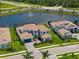 An aerial view shows this pristine, two-story home that sits on a manicured lawn in a well-kept community at 18215 Cayo Largo Pl, Bradenton, FL 34202
