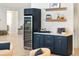 Wet bar featuring custom cabinetry and a wine refrigerator at 18215 Cayo Largo Pl, Bradenton, FL 34202