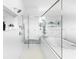 Modern bathroom with glass-enclosed shower, soaking tub, patterned tile floor, and upscale finishes at 18215 Cayo Largo Pl, Bradenton, FL 34202