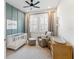 Cozy Bedroom features a neutral color palette, a crib, chair, and plenty of natural light at 18215 Cayo Largo Pl, Bradenton, FL 34202
