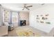 bedroom featuring fun wallpaper, a cozy chair, and colorful decor at 18215 Cayo Largo Pl, Bradenton, FL 34202