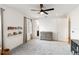 Neutral Bedroom design features carpet flooring, ceiling fan, book shelves, and plenty of natural light at 18215 Cayo Largo Pl, Bradenton, FL 34202