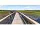 Stroll on the long boardwalk through natural wetlands, and enjoy serene community views at 18215 Cayo Largo Pl, Bradenton, FL 34202