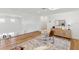 Upstairs landing featuring hardwood floors, a cozy chair, and bright, airy design at 18215 Cayo Largo Pl, Bradenton, FL 34202