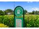 Dog park sign, surrounded by lush green landscaping in a well-maintained community at 18215 Cayo Largo Pl, Bradenton, FL 34202