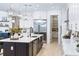 Well-appointed kitchen with a large island, stainless steel appliances, and modern fixtures at 18215 Cayo Largo Pl, Bradenton, FL 34202