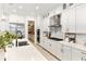 Beautiful white kitchen with stainless steel appliances and a view into the pantry at 18215 Cayo Largo Pl, Bradenton, FL 34202