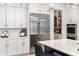 Modern kitchen with stainless steel appliances and a view of the walk-in pantry at 18215 Cayo Largo Pl, Bradenton, FL 34202