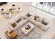 Bright open-concept living room features modern furniture and decor with sliding glass doors at 18215 Cayo Largo Pl, Bradenton, FL 34202