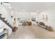 Spacious living room with high ceilings, light wood floors, modern decor and large windows with lake views at 18215 Cayo Largo Pl, Bradenton, FL 34202