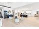 Bright and modern open-concept living space with a gourmet kitchen and contemporary furnishings at 18215 Cayo Largo Pl, Bradenton, FL 34202