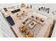 Open-concept living room with views of the kitchen and dining area, with tile floors and cozy seating at 18215 Cayo Largo Pl, Bradenton, FL 34202