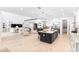 Spacious open floor plan showcases the living room and kitchen with modern finishes at 18215 Cayo Largo Pl, Bradenton, FL 34202