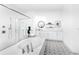 Stunning main bathroom with a freestanding tub, a glass shower, and patterned tile flooring at 18215 Cayo Largo Pl, Bradenton, FL 34202