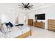 Spacious main bedroom with tray ceiling, wood furniture, and decorative blue accents at 18215 Cayo Largo Pl, Bradenton, FL 34202