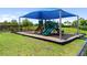 Community playground with shade cover, slides, and climbing structures for outdoor fun at 18215 Cayo Largo Pl, Bradenton, FL 34202