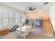 Spacious playroom features carpet flooring, ceiling fan, several windows, slide, and play kitchen at 18215 Cayo Largo Pl, Bradenton, FL 34202